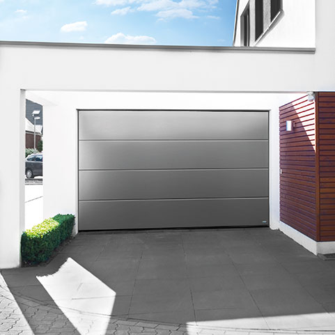 Grey sectional garage door on high end residential property