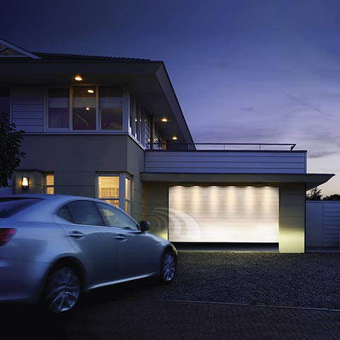 Sectional garage that opens automatically from car on arrival