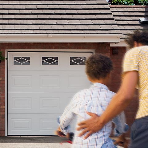 White sectional garage with 3 glass windows